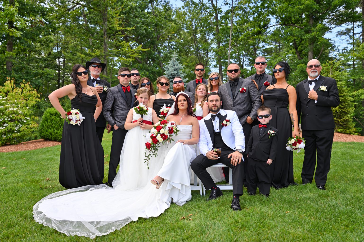 Black and white portrait of the wedding party in sunglasses